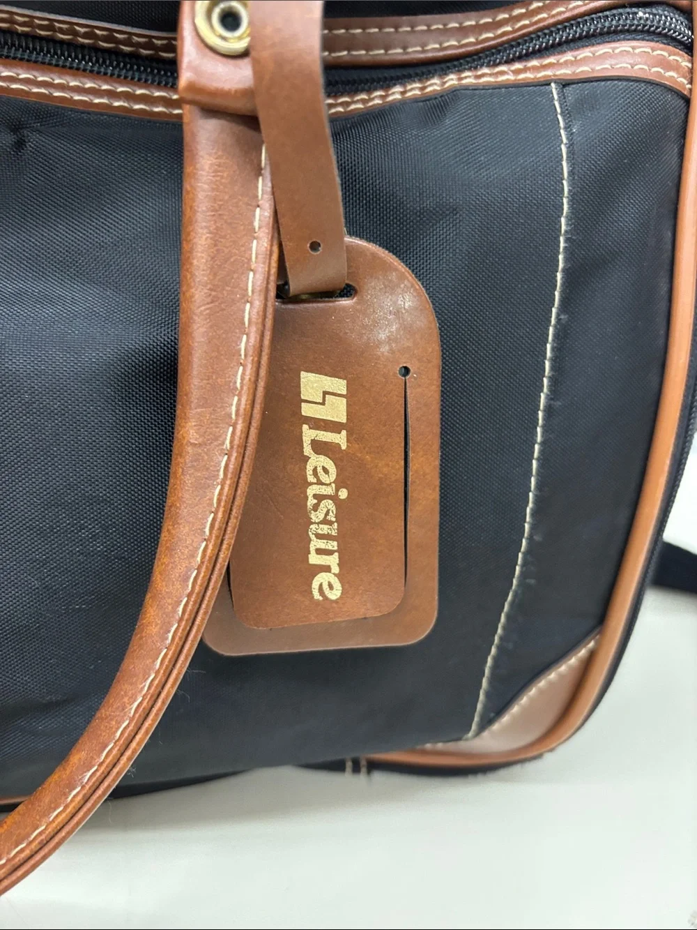 Leisure Black Travel Duffel Bag with Brown Trim and Stripe Accent